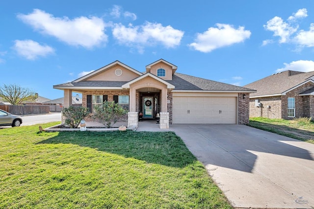 single story home featuring a front lawn and a garage