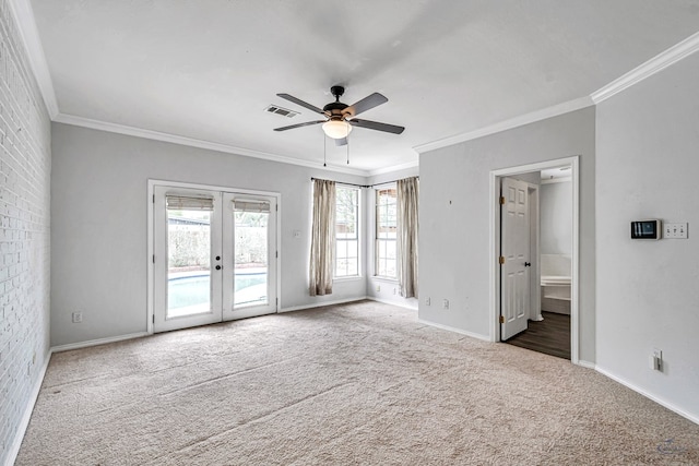 2008 Bedford Dr, Midland, TX 79701 - spare room with french doors, carpet flooring, ceiling fan, ornamental molding, and baseboards