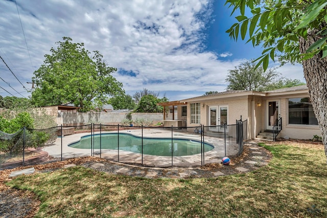 2008 Bedford Dr, Midland, TX 79701 - view of swimming pool featuring french doors and a patio