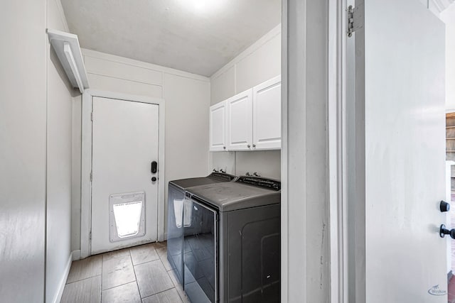 2008 Bedford Dr, Midland, TX 79701 - laundry room with cabinet space and washing machine and dryer