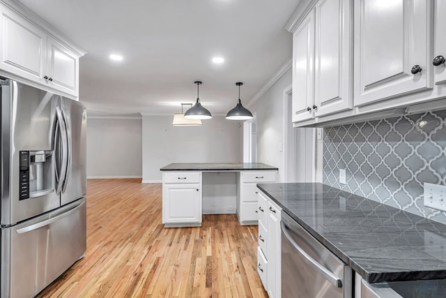 2008 Bedford Dr, Midland, TX 79701 - kitchen with stainless steel appliances, crown molding, white cabinets, light wood-style floors, and recessed lighting