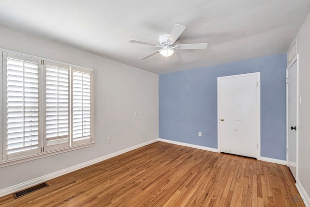 2008 Bedford Dr, Midland, TX 79701 - unfurnished bedroom featuring wood finished floors, baseboards, and ceiling fan