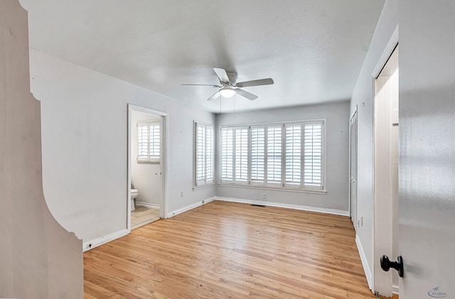2008 Bedford Dr, Midland, TX 79701 - spare room featuring a ceiling fan, light wood-style floors, and baseboards