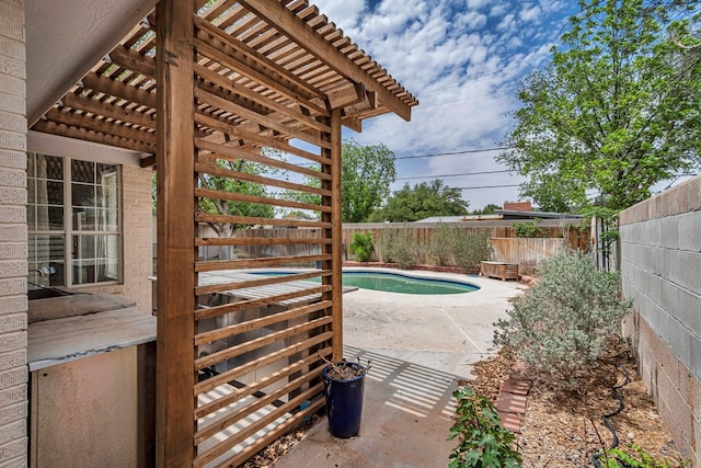 2008 Bedford Dr, Midland, TX 79701 - view of pool with a patio, a fenced backyard, and a pergola