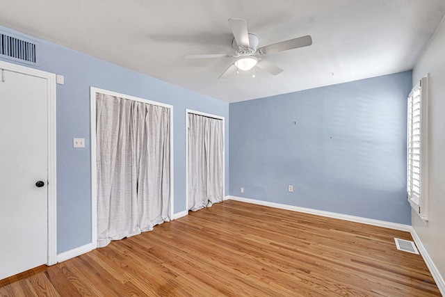 2008 Bedford Dr, Midland, TX 79701 - empty room featuring a ceiling fan, wood finished floors, and baseboards