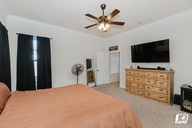 bedroom featuring carpet floors, ceiling fan, visible vents, and crown molding