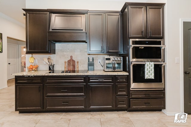 kitchen with light stone counters, backsplash, double oven, ornamental molding, and black electric cooktop