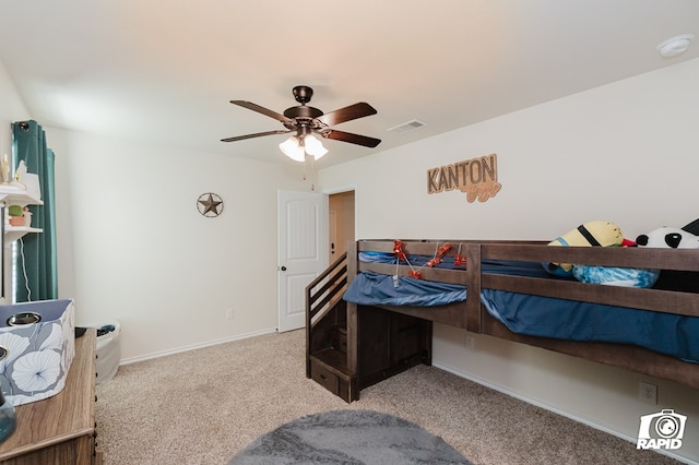 bedroom featuring ceiling fan, carpet, visible vents, and baseboards