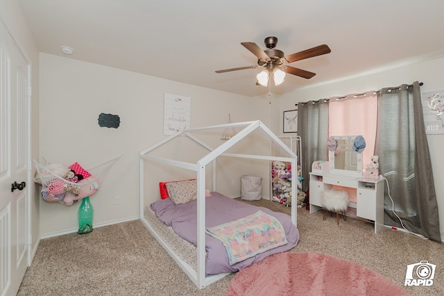 bedroom with carpet floors, ceiling fan, and baseboards