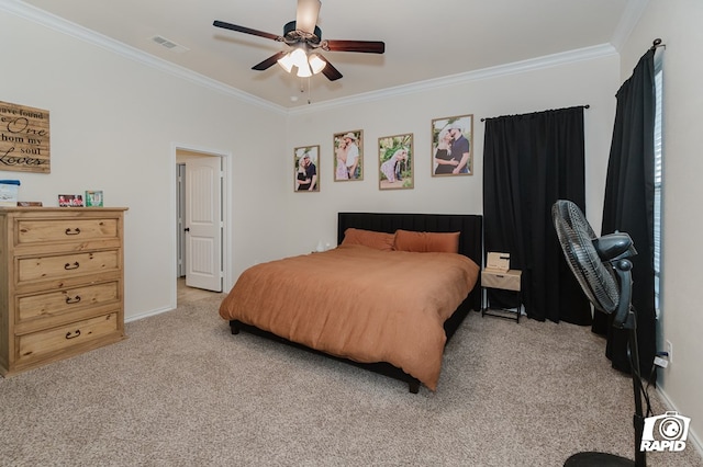 bedroom featuring visible vents, ornamental molding, a ceiling fan, and light colored carpet