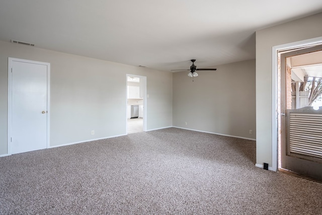 carpeted empty room featuring a ceiling fan and baseboards