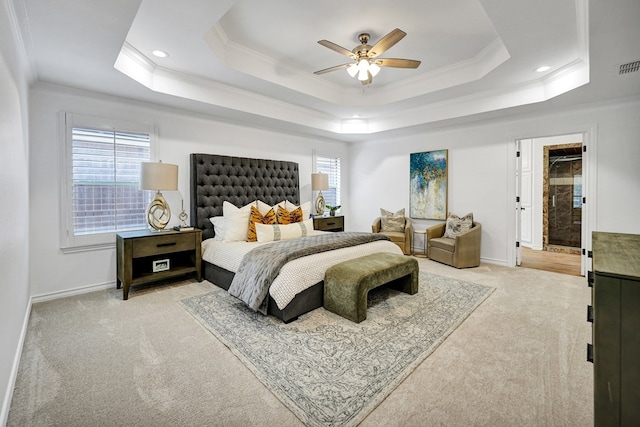 carpeted bedroom featuring a raised ceiling, ceiling fan, and ornamental molding