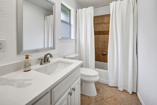 full bathroom with tile patterned flooring, vanity, toilet, and shower / tub combo