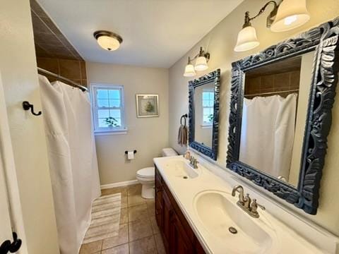 3302 Cord Dr, Midland, TX 79705 - bathroom with double vanity, tile patterned floors, and curtained shower