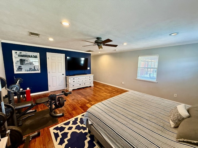 3302 Cord Dr, Midland, TX 79705 - bedroom featuring recessed lighting, crown molding, wood finished floors, and ceiling fan
