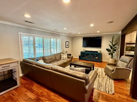 3302 Cord Dr, Midland, TX 79705 - living area featuring crown molding, recessed lighting, and wood finished floors