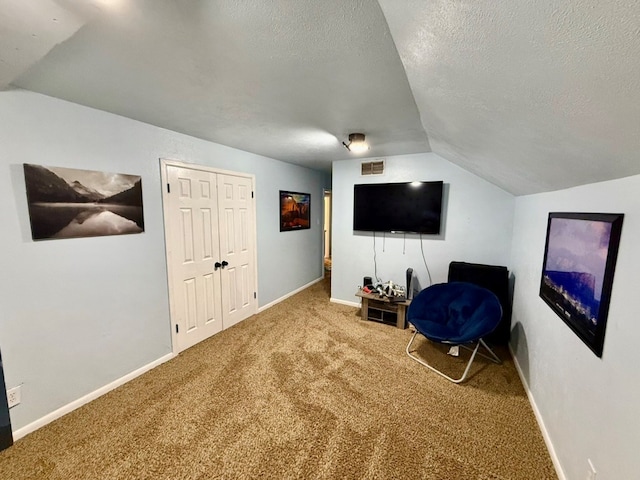 3302 Cord Dr, Midland, TX 79705 - living area with vaulted ceiling, carpet floors, and a textured ceiling