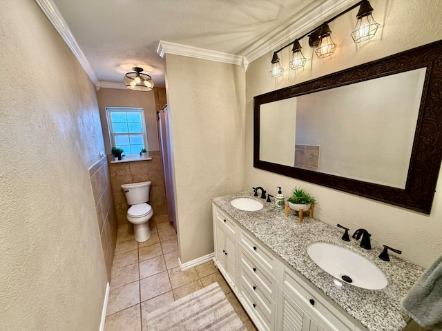 3302 Cord Dr, Midland, TX 79705 - bathroom with tile patterned flooring, double vanity, ornamental molding, and a textured wall