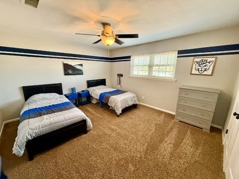 3302 Cord Dr, Midland, TX 79705 - bedroom with carpet floors and a ceiling fan