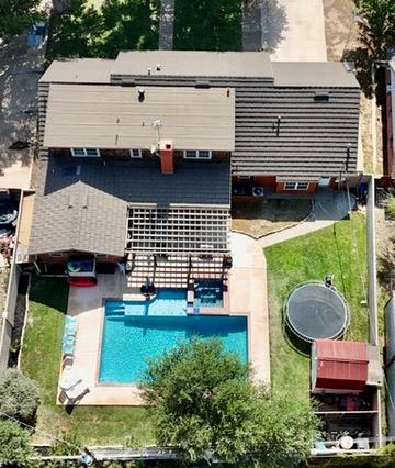 3302 Cord Dr, Midland, TX 79705 - aerial view of property and surrounding area with a pool area