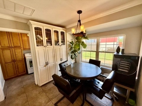 3302 Cord Dr, Midland, TX 79705 - tiled dining room with washer / dryer and ornamental molding
