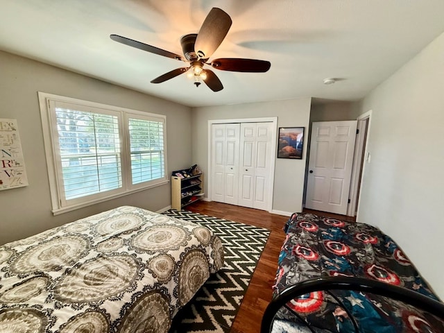 3302 Cord Dr, Midland, TX 79705 - bedroom with dark wood-type flooring, a closet, and a ceiling fan