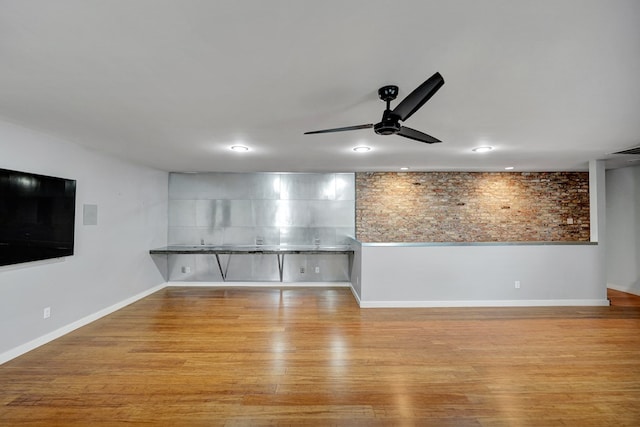 unfurnished living room with a ceiling fan, wood finished floors, visible vents, and recessed lighting