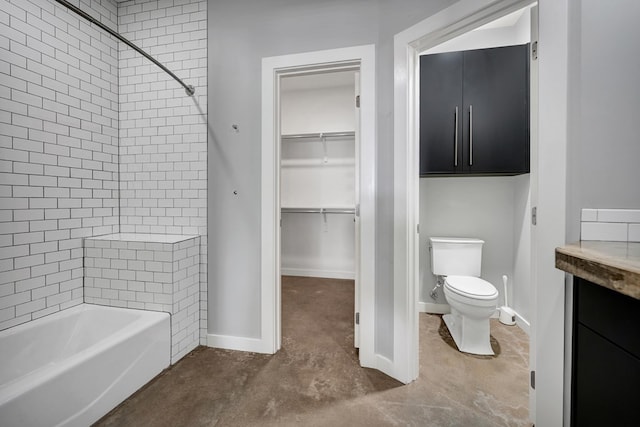 bathroom featuring a spacious closet, toilet, baseboards, concrete floors, and bathtub / shower combination