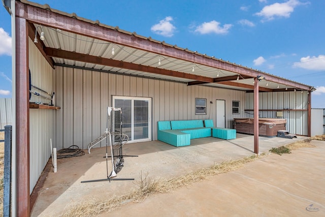 view of patio / terrace featuring a hot tub