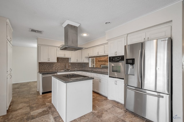 kitchen with dark countertops, visible vents, decorative backsplash, island range hood, and stainless steel appliances