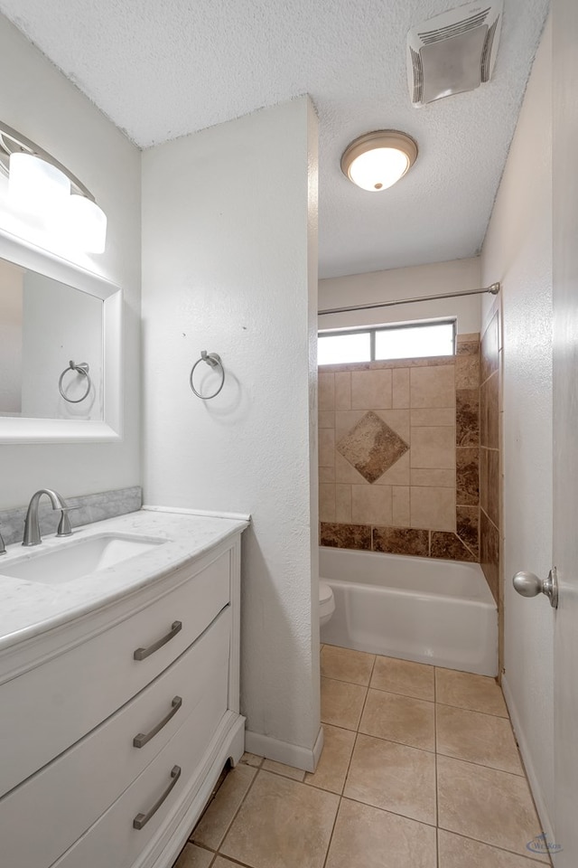 bathroom featuring visible vents, shower / washtub combination, vanity, tile patterned floors, and a textured ceiling