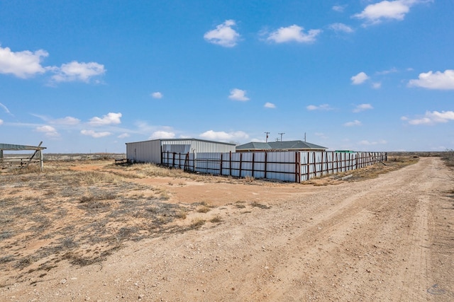 view of stable featuring a rural view