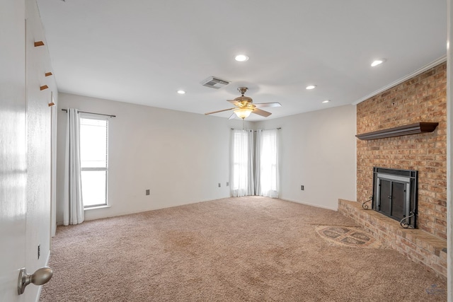 unfurnished living room featuring visible vents, recessed lighting, carpet, a brick fireplace, and ceiling fan