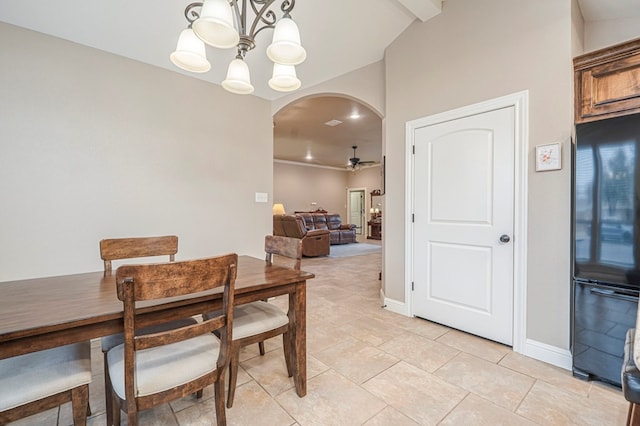 tiled dining room featuring ceiling fan with notable chandelier