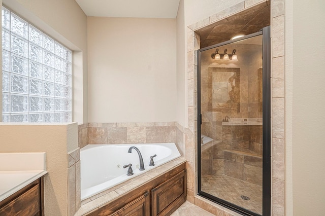 bathroom with separate shower and tub