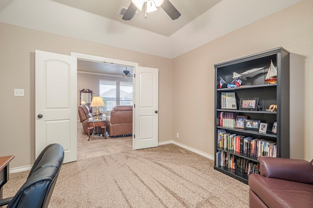 carpeted home office with ceiling fan