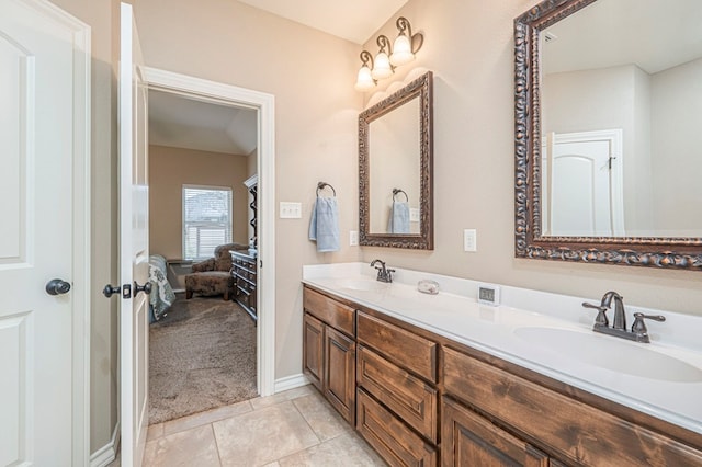 bathroom with tile patterned flooring and vanity