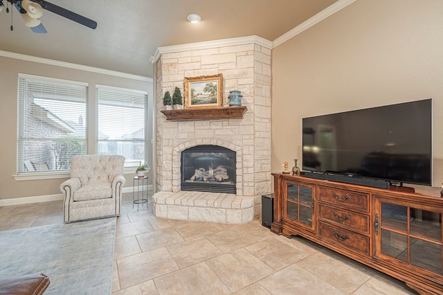 living room featuring ornamental molding, ceiling fan, and a fireplace