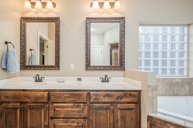 bathroom featuring vanity and a tub