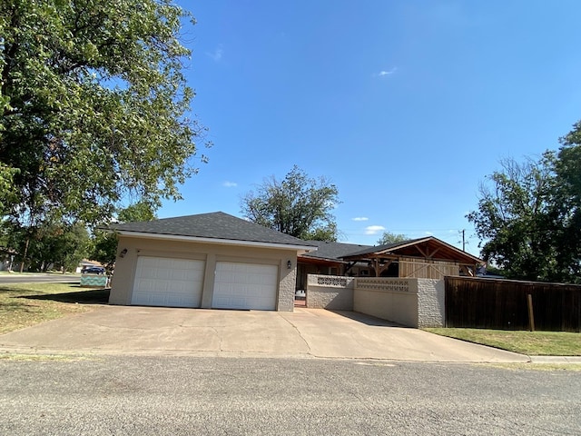 3501 Austin Pl, Snyder, TX 79549 - single story home featuring an attached garage, a fenced front yard, and concrete driveway