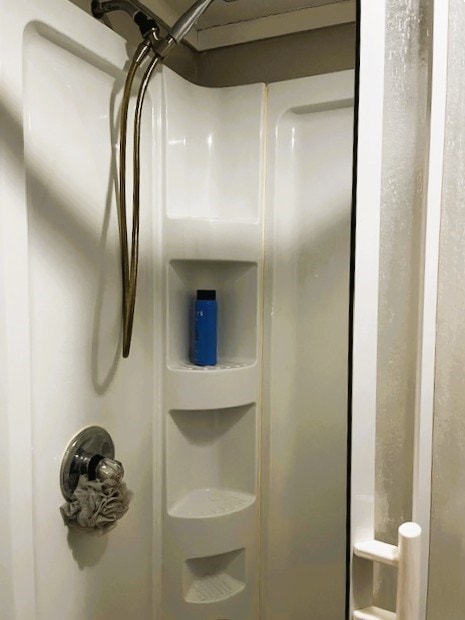 interior details featuring a shower stall