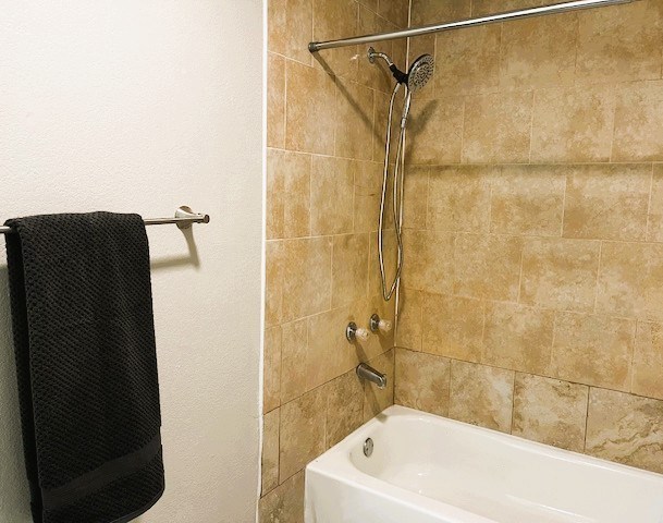 full bath with bathing tub / shower combination