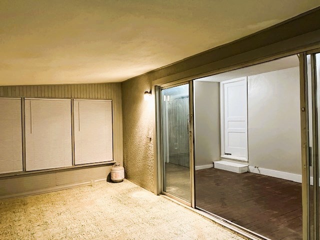 bathroom featuring baseboards and wood finished floors