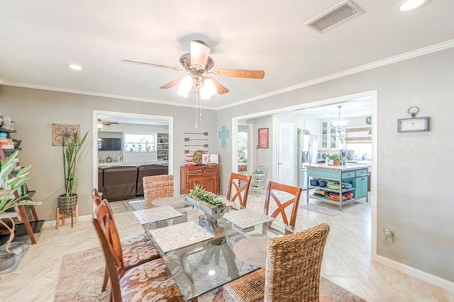 dining room featuring ceiling fan, visible vents, baseboards, ornamental molding, and recessed lighting