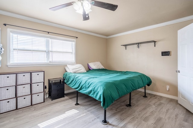 1829 Petroleum Dr, Odessa, TX 79762 - bedroom featuring wood finished floors, baseboards, crown molding, and ceiling fan