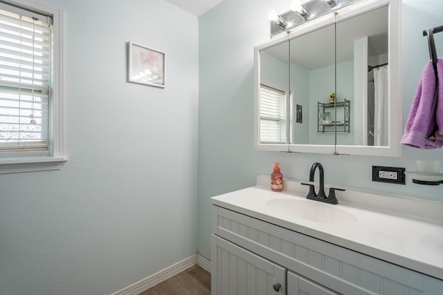 1829 Petroleum Dr, Odessa, TX 79762 - full bath with vanity, plenty of natural light, and baseboards