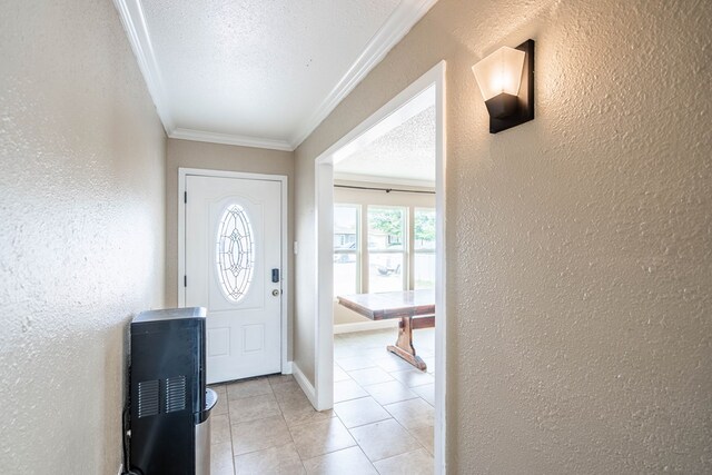 1829 Petroleum Dr, Odessa, TX 79762 - foyer with a textured wall, ornamental molding, a textured ceiling, light tile patterned floors, and baseboards
