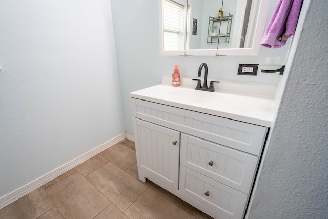 1829 Petroleum Dr, Odessa, TX 79762 - bathroom with vanity, tile patterned floors, and baseboards