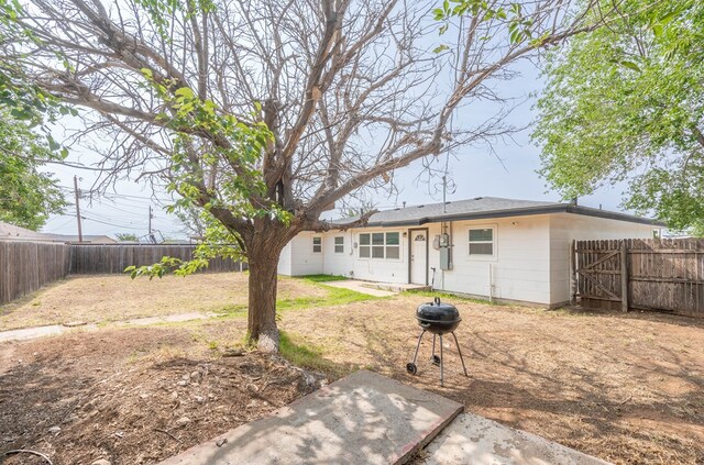 1829 Petroleum Dr, Odessa, TX 79762 - back of house with a fenced backyard