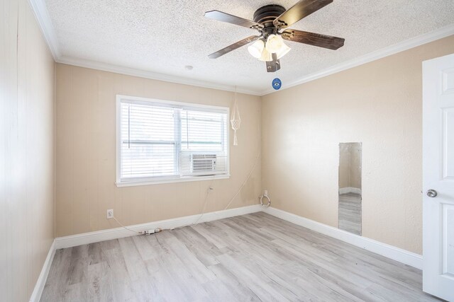 1829 Petroleum Dr, Odessa, TX 79762 - empty room featuring a textured ceiling, wood finished floors, ceiling fan, ornamental molding, and baseboards
